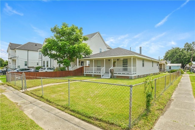 1401 Claiborne Dr, Jefferson, LA 70121 - view of front of property featuring covered porch, a fenced front yard, and a shingled roof