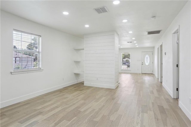 1401 Claiborne Dr, Jefferson, LA 70121 - unfurnished living room with recessed lighting, light wood-style floors, and baseboards
