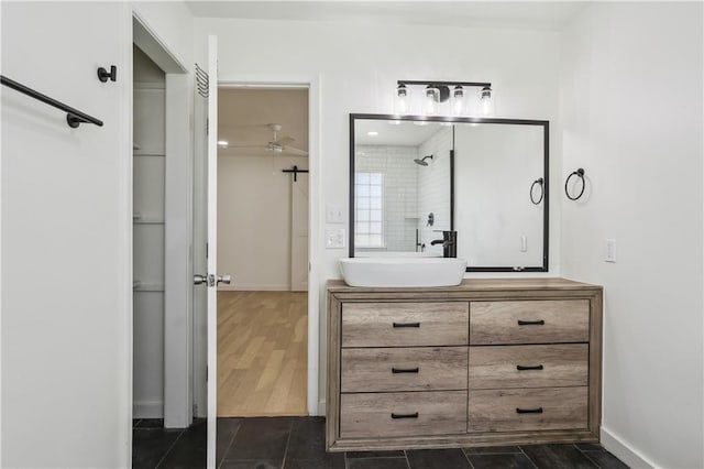 1401 Claiborne Dr, Jefferson, LA 70121 - full bath with a ceiling fan, vanity, baseboards, and a shower