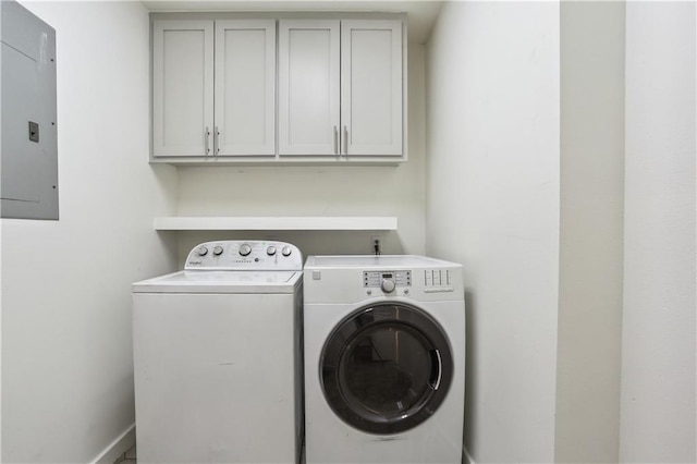 1401 Claiborne Dr, Jefferson, LA 70121 - clothes washing area featuring washer and dryer, electric panel, and cabinet space
