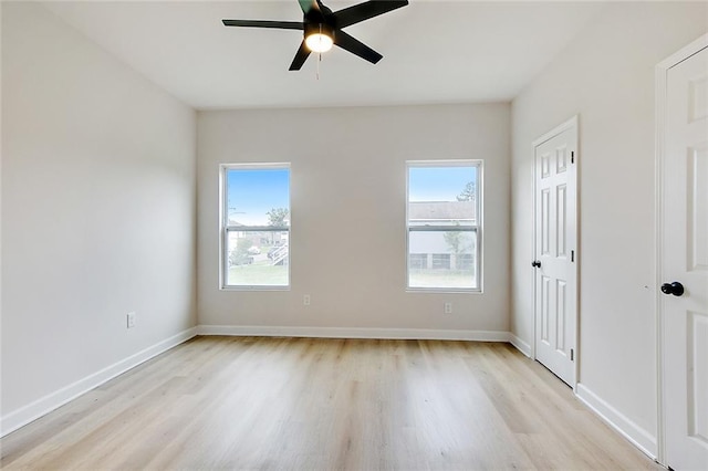 340606 Jackson Ave, New Orleans, LA 70125 - unfurnished bedroom featuring light wood-type flooring, multiple windows, and baseboards