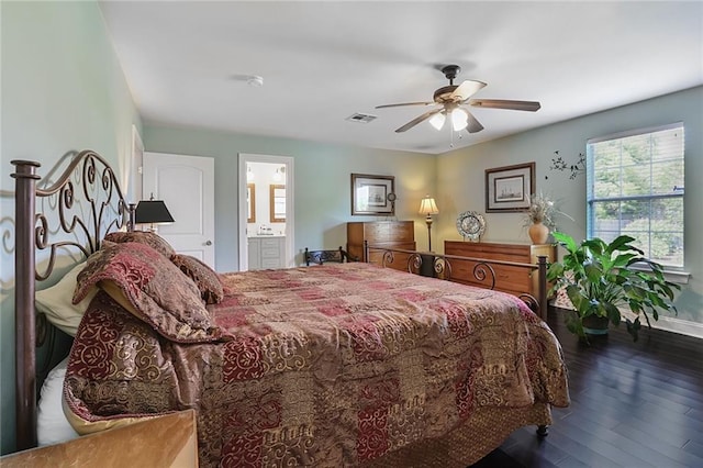 309 Wallace Dr, New Orleans, LA 70122 - bedroom featuring wood finished floors, baseboards, a ceiling fan, and ensuite bathroom