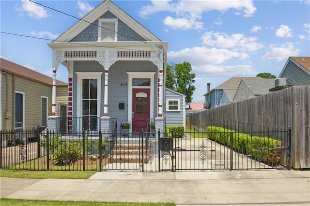 4119 S Liberty St, New Orleans, LA 70115 - view of front of home featuring a fenced front yard, a porch, and a gate