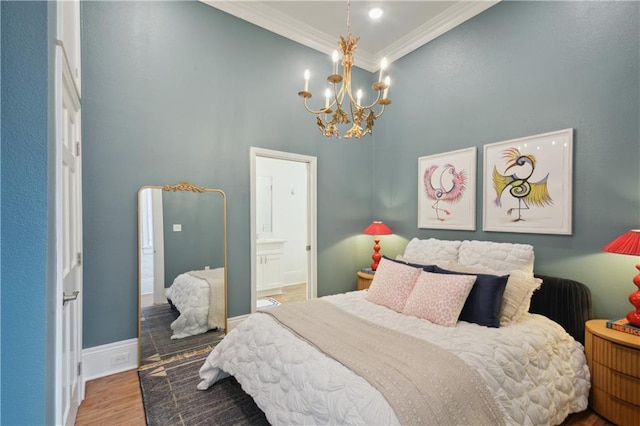 4119 S Liberty St, New Orleans, LA 70115 - bedroom featuring crown molding, a chandelier, wood finished floors, a high ceiling, and connected bathroom