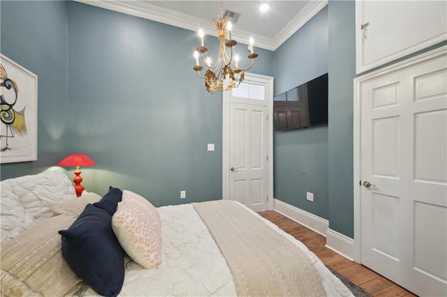 4119 S Liberty St, New Orleans, LA 70115 - bedroom featuring ornamental molding, wood finished floors, a chandelier, and baseboards