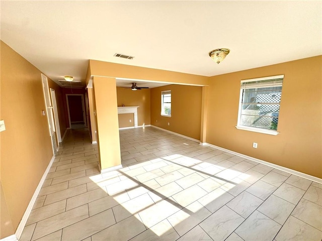 1523 W Dr, Westwego, LA 70094 - empty room with a ceiling fan and baseboards