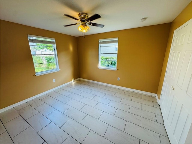 1523 W Dr, Westwego, LA 70094 - empty room featuring healthy amount of natural light, baseboards, and ceiling fan