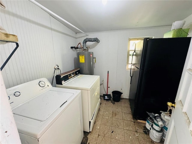 1523 W Dr, Westwego, LA 70094 - laundry room featuring electric water heater, washing machine and clothes dryer, and baseboards