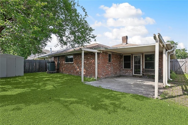 1508 Apple St, Metairie, LA 70001 - rear view of property with central AC unit, a patio, a storage unit, an outbuilding, and brick siding