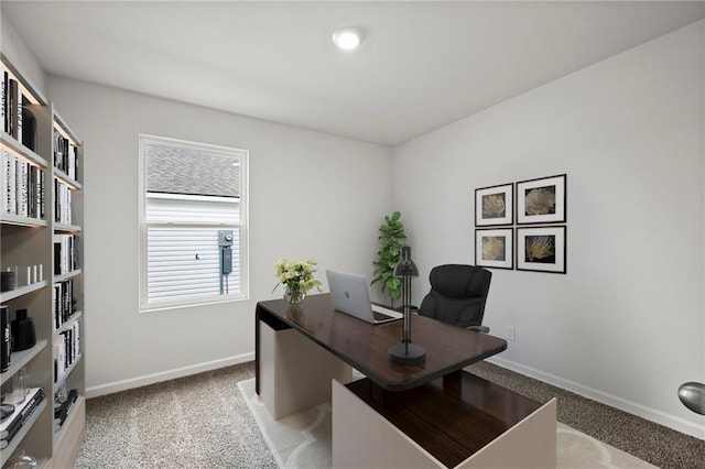 home office with light carpet and baseboards