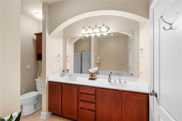 40145 Taylor Trl Unit 503, Slidell, LA 70461 - bathroom featuring a stall shower, toilet, double vanity, tile patterned flooring, and a bath