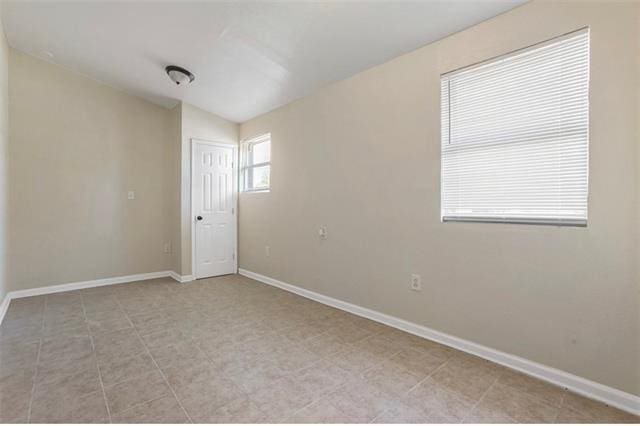 1444 Egania St, New Orleans, LA 70117 - spare room featuring baseboards