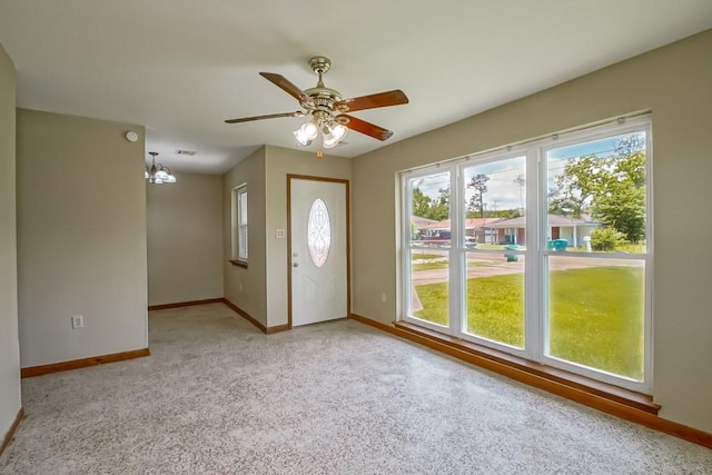 3233 Duncan St, Slidell, LA 70458 - foyer featuring healthy amount of natural light, baseboards, light colored carpet, and ceiling fan