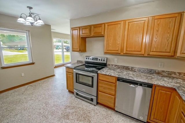 3233 Duncan St, Slidell, LA 70458 - kitchen featuring stainless steel appliances, a chandelier, baseboards, and hanging light fixtures