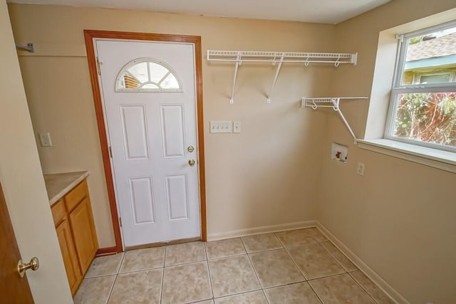 3233 Duncan St, Slidell, LA 70458 - laundry area featuring hookup for a washing machine, baseboards, and light tile patterned flooring
