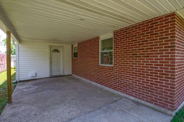 3233 Duncan St, Slidell, LA 70458 - property entrance with a carport and brick siding
