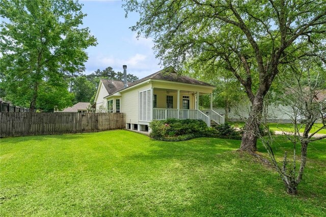 22236 8th St, Abita Springs, LA 70420 - rear view of property with a ceiling fan and driveway