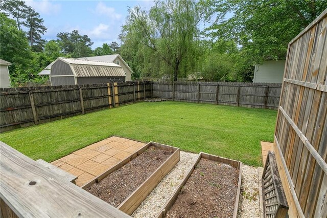 22236 8th St, Abita Springs, LA 70420 - rear view of house with a fenced backyard, roof mounted solar panels, and a deck