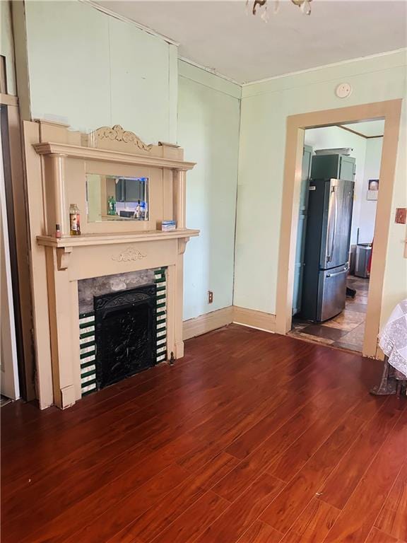 307 Diana St, New Orleans, LA 70114 - unfurnished living room with wood finished floors and a fireplace