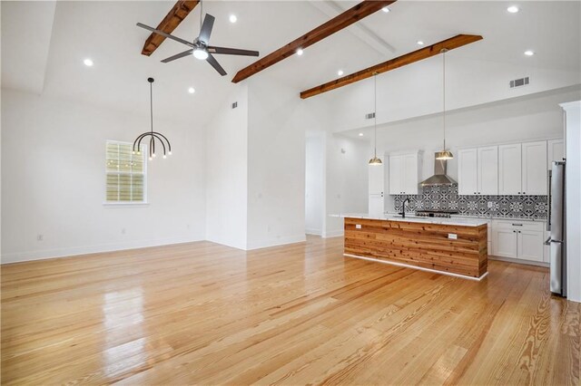 5519 Wingate Dr, New Orleans, LA 70122 - living area with ceiling fan, high vaulted ceiling, beamed ceiling, light wood-style flooring, and recessed lighting
