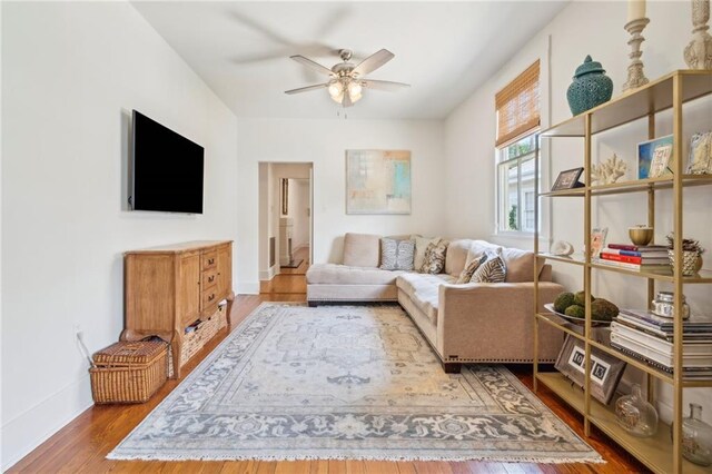 317 Henry Clay Ave, New Orleans, LA 70118 - living area with a ceiling fan, wood finished floors, and baseboards