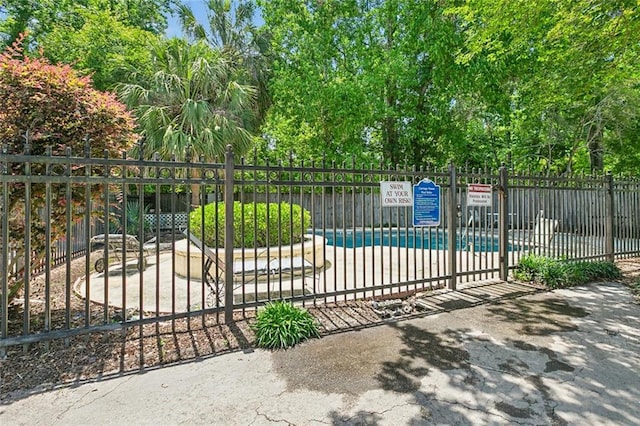 community pool featuring fence