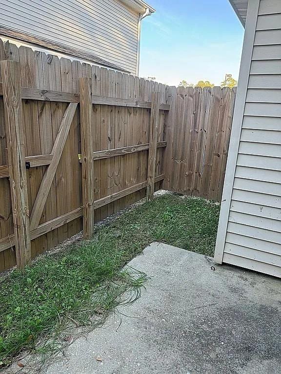 view of yard with fence and a patio area