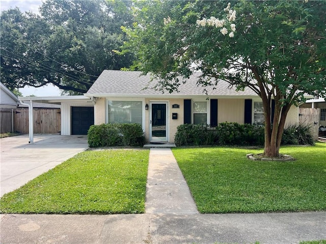 817 N Sibley St, Metairie, LA 70003 - view of front of house with driveway, an attached carport, and roof with shingles