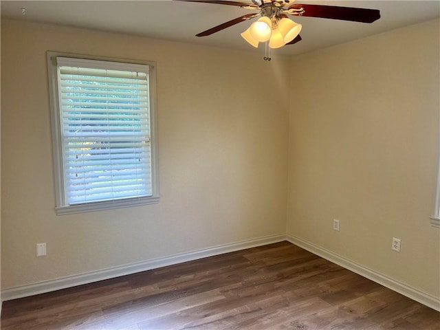 817 N Sibley St, Metairie, LA 70003 - unfurnished room featuring a ceiling fan, dark wood-style flooring, and baseboards