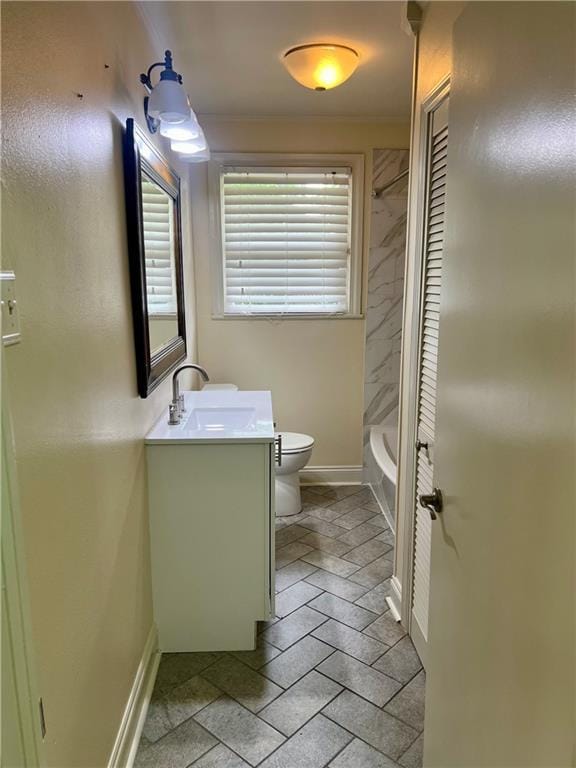 817 N Sibley St, Metairie, LA 70003 - bathroom featuring baseboards, vanity, toilet, and bathtub / shower combination