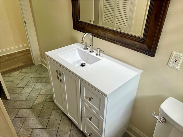 817 N Sibley St, Metairie, LA 70003 - half bath with baseboards, vanity, and toilet
