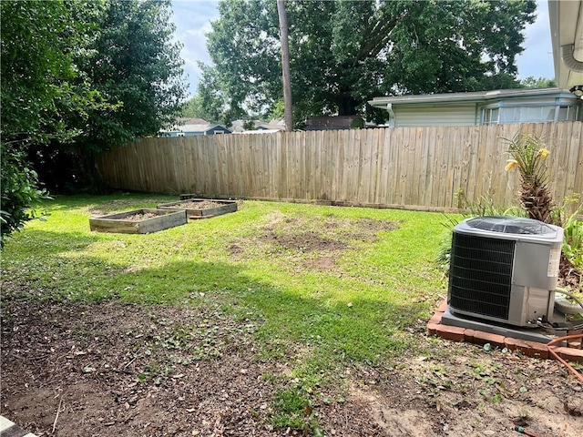 817 N Sibley St, Metairie, LA 70003 - view of yard featuring central AC and a vegetable garden