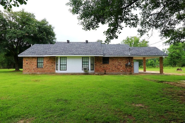 42073 Farlow Ln, Ponchatoula, LA 70454 - view of front of home with a front lawn, brick siding, and a carport