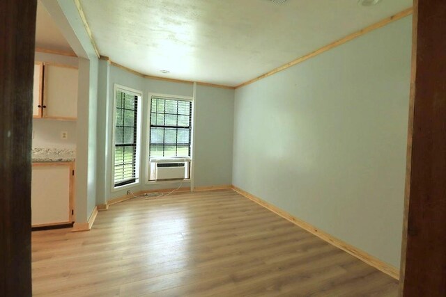 42073 Farlow Ln, Ponchatoula, LA 70454 - empty room featuring ornamental molding, cooling unit, light wood-type flooring, and baseboards