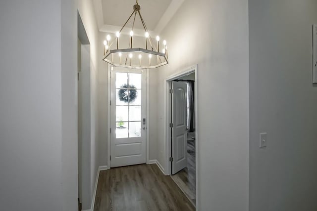 39352 Nutall Oak Ave, Prairieville, LA 70769 - foyer featuring wood finished floors, a chandelier, and baseboards