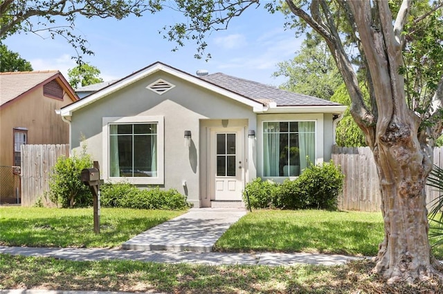 2067 Lafreniere St, New Orleans, LA 70122 - bungalow-style house featuring stucco siding