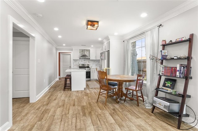2067 Lafreniere St, New Orleans, LA 70122 - dining room with light wood-style flooring, recessed lighting, crown molding, and baseboards