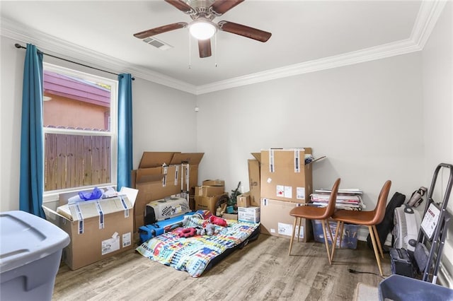 2067 Lafreniere St, New Orleans, LA 70122 - bedroom featuring wood finished floors, ornamental molding, and a ceiling fan