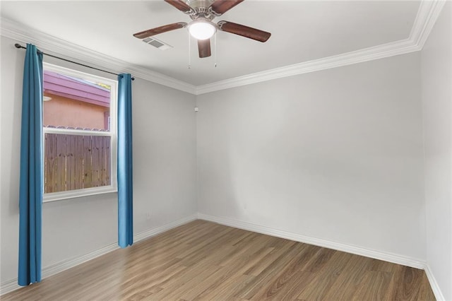 2067 Lafreniere St, New Orleans, LA 70122 - spare room featuring wood finished floors, baseboards, crown molding, and a ceiling fan