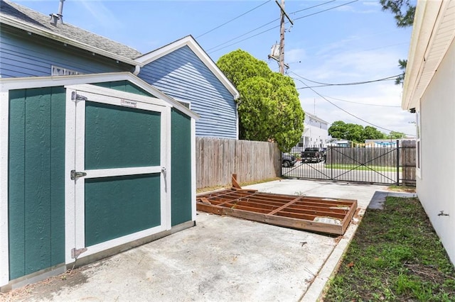 2067 Lafreniere St, New Orleans, LA 70122 - view of patio / terrace featuring fence, an outbuilding, and a storage shed