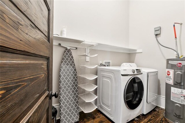 1607 N Villere St, New Orleans, LA 70116 - laundry room with electric water heater, washing machine and dryer, and dark wood-type flooring