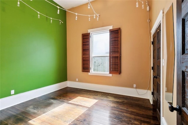 1607 N Villere St, New Orleans, LA 70116 - unfurnished room featuring wood finished floors, a fireplace, and baseboards