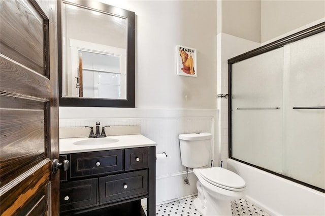 1607 N Villere St, New Orleans, LA 70116 - full bath featuring wainscoting, vanity, toilet, and enclosed tub / shower combo