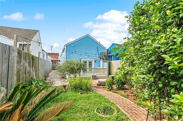 1607 N Villere St, New Orleans, LA 70116 - rear view of house with a fenced backyard and a deck