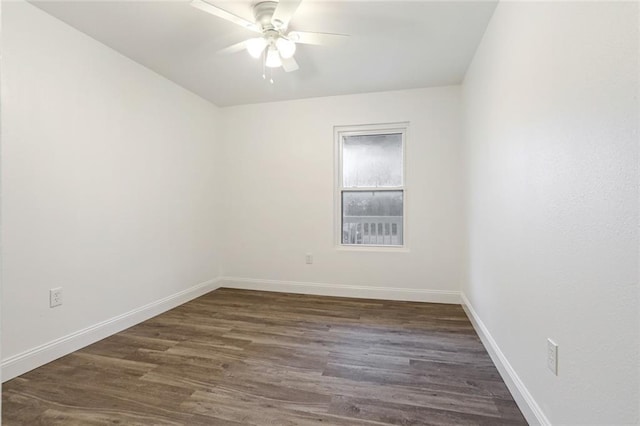 70454 B St, Covington, LA 70433 - empty room featuring ceiling fan, dark wood-style flooring, and baseboards