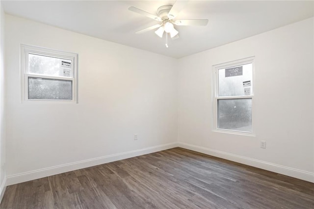 70454 B St, Covington, LA 70433 - spare room with plenty of natural light, dark wood-style floors, baseboards, and ceiling fan
