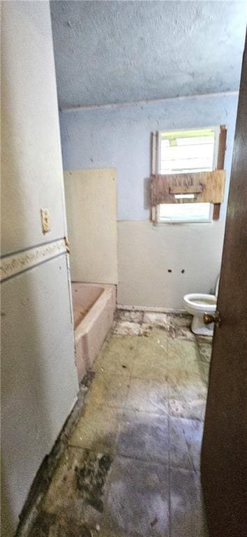 140 N 14th St, Ponchatoula, LA 70454 - full bathroom featuring toilet and a tub to relax in