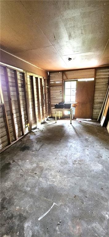 140 N 14th St, Ponchatoula, LA 70454 - miscellaneous room with concrete flooring and wooden walls