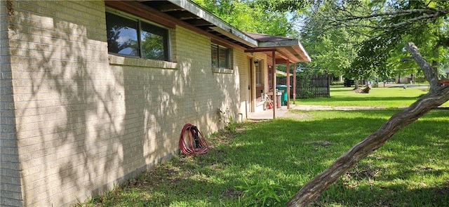 140 N 14th St, Ponchatoula, LA 70454 - view of side of property featuring a lawn