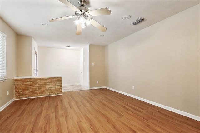 5927 Brighton Pl, New Orleans, LA 70131 - empty room featuring light wood-style floors, baseboards, ceiling fan, and plenty of natural light